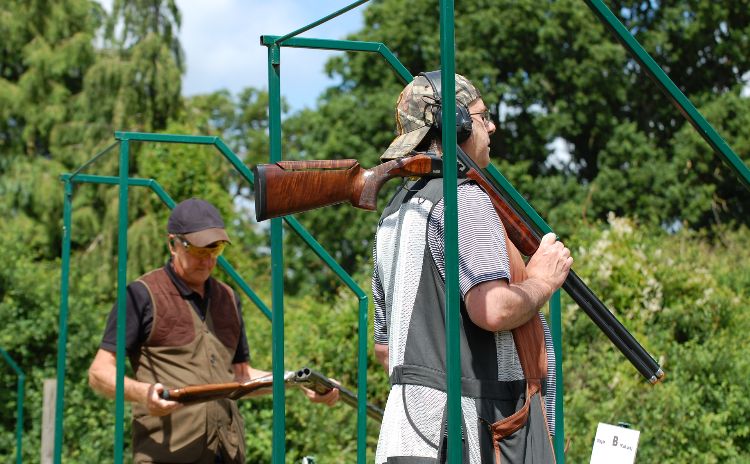 Two men clay pigeon shooting